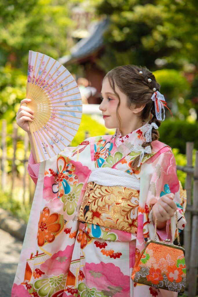 Kids kimono rental in Asakusa with floral kimono and Japanese fan