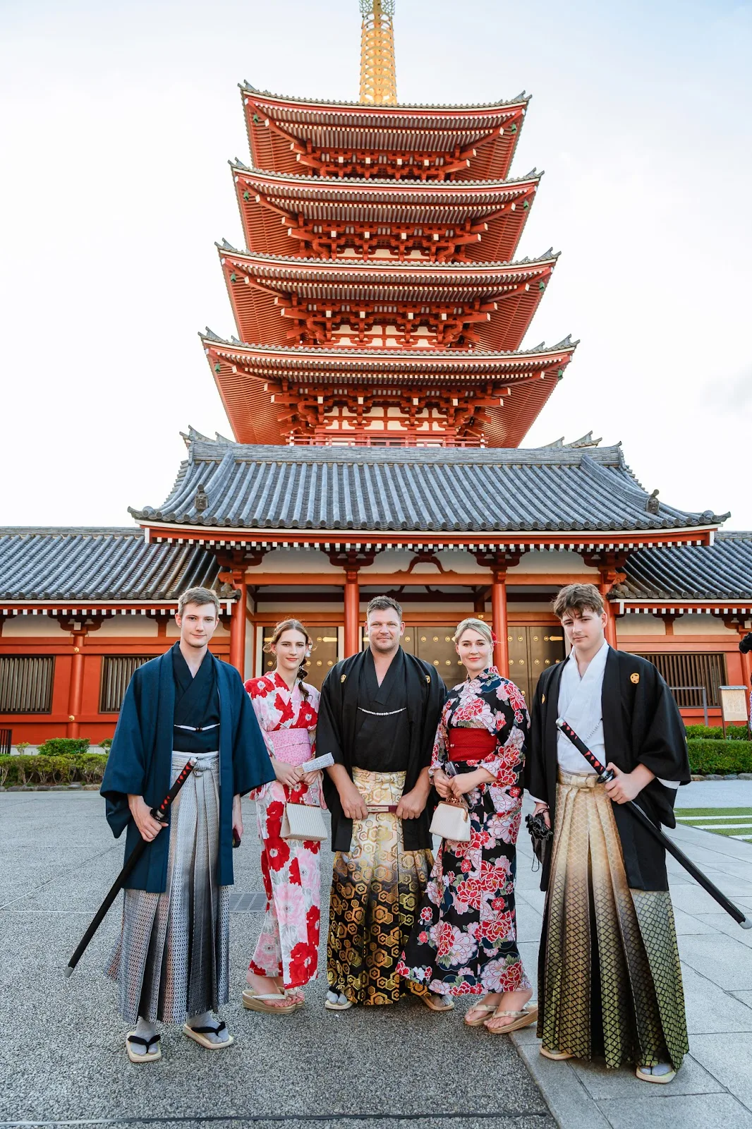 Large family group in kimono and hakama in front of the Five-Storied Pagoda at Sensoji
