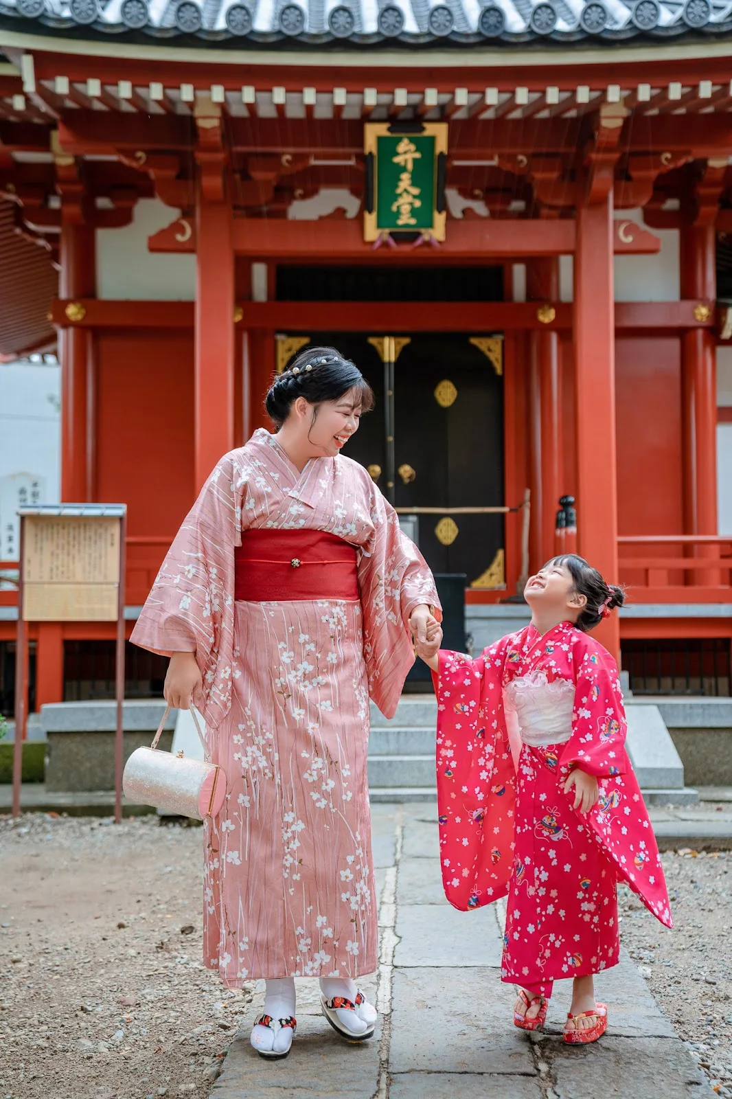 Mother and young daughter in matching pink kimono at Sensoji Temple, Asakusa