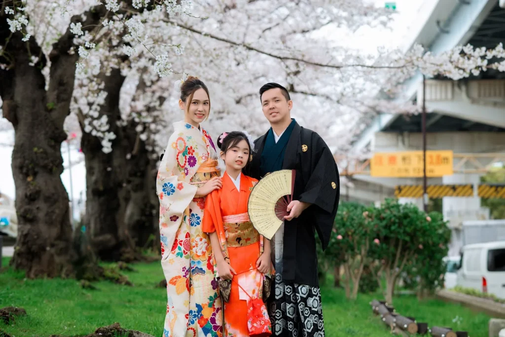 Family in kimono under cherry blossoms in Asakusa in spring