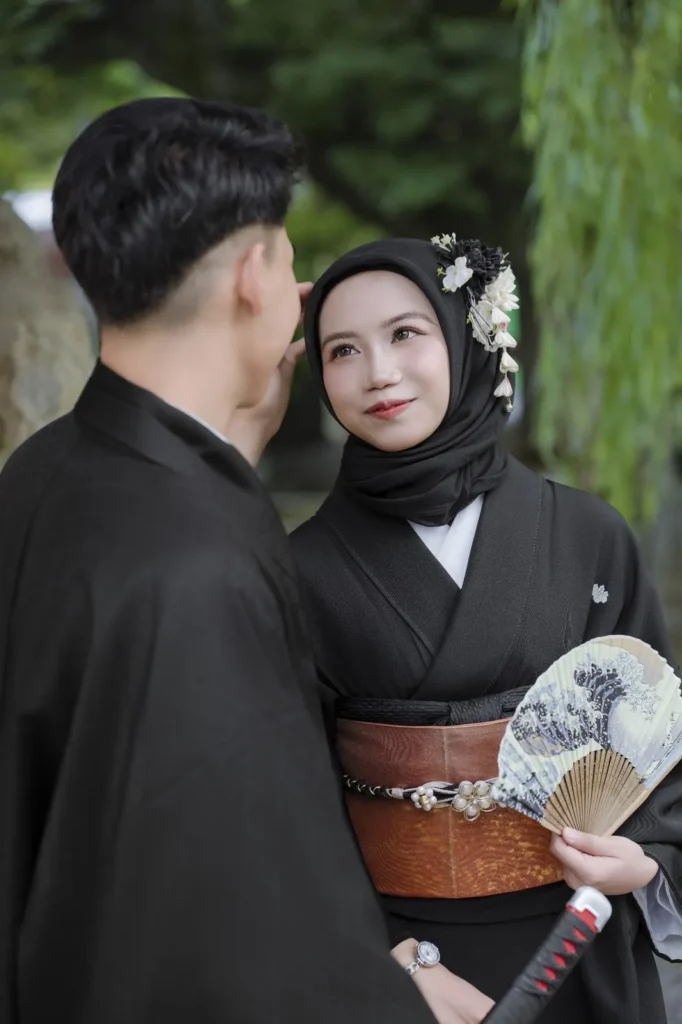 Black hijab with white hair flowers matched to a black kimono and brown obi, Asakusa kimono photoshoot