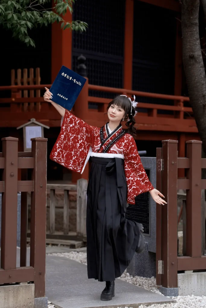 Red lace kimono and black hakama worn with short black boots, a stylish winter kimono look in Asakusa
