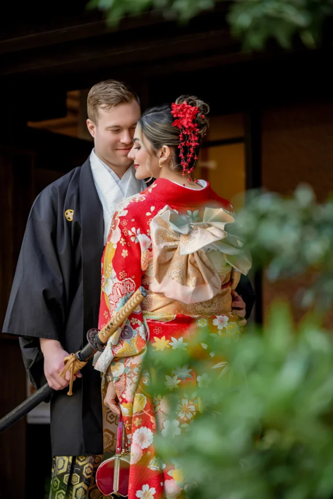 Couple in kimono and hakama on Hanayashiki Street in West Asakusa